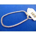 A White metal unmarked Diamond line bracelet,