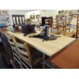 A pine table and four chairs with rush seats,