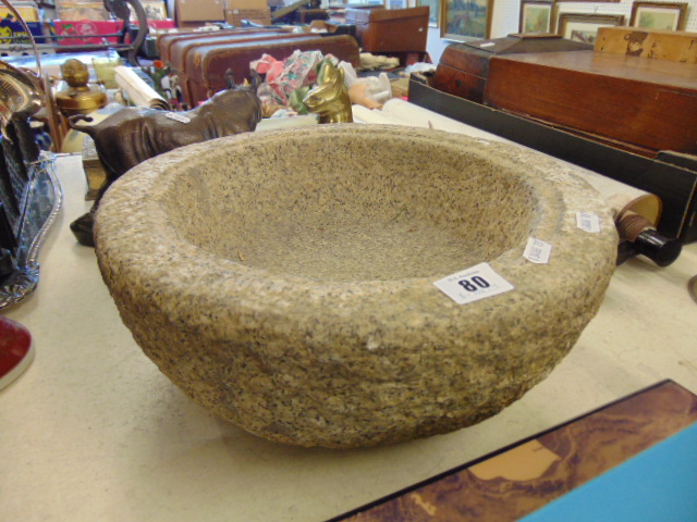 A granite bird bath bowl