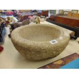 A granite bird bath bowl