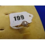 An 18ct Gold Diamond cluster ring, centre Diamond 26pts,