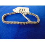 An 18ct White gold Diamond line bracelet, 140 Diamonds in total,