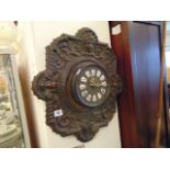 A wooden and metal Gothic clock