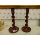 A pair of barley twist candlesticks