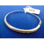 An 18ct White Gold and Diamond bangle