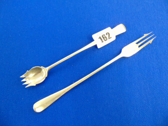 Two hallmarked Silver pickle forks, 1.