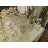 A qty of glassware some Silver tops