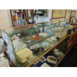 A glass counter top display cabinet