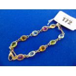 An 18ct Gold multi gem set bracelet,