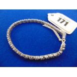 An 18ct White gold Diamond line bracelet, 140 Diamonds in total,