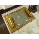 A Brass decorative brush mirror