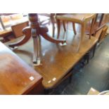 An Oak expending table, extra leaf,