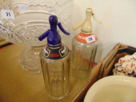 Two soda siphons