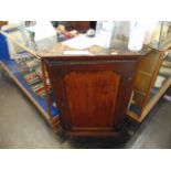 An Oak corner cupboard