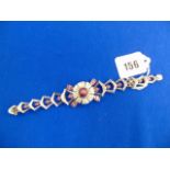 A fancy 18ct White Gold Diamond and Ruby bracelet, set with a 'Sugar loaf' star Ruby,