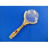 An antique Silver and gem set magnifying glass