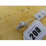 An 18ct White Gold Emerald cut Diamond ring, centre stone 1ct,