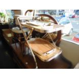 A gilt tea trolley and a qty of trays