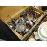 A suitcase containing silver plate,