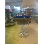 A decorative glass bowl on a fancy glass twisted stem