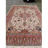 A Good quality Persian rug, red ground,