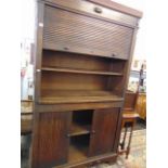 An Oak Tambour front cupboard