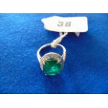 An 18ct White Gold Diamond and Emerald ring,