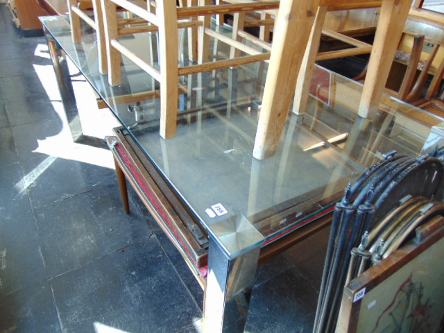 A glass contemporary dining table