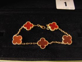 A Van Cleef and Arpels Alhambra 18ct Gold bracelet set with Cornelian