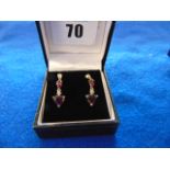 A pair of 9ct Gold Diamond and Ruby drop earrings