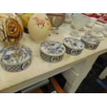 Four decorative blue and white trinket boxes