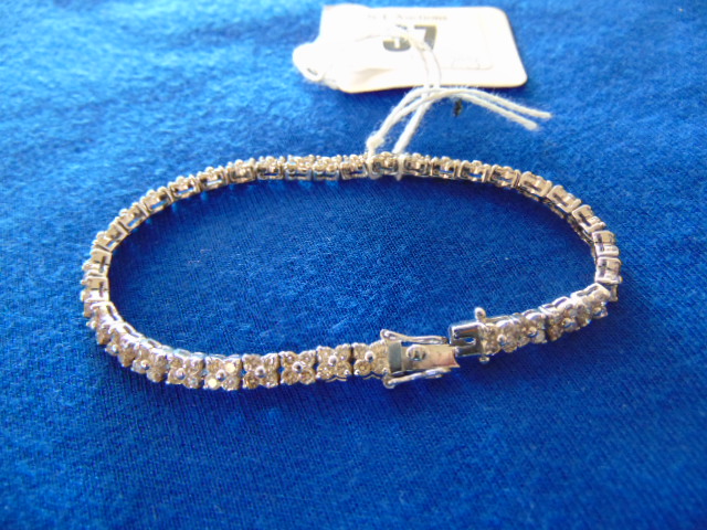 An 18ct White Gold hallmarked Diamond double row Tennis bracelet, set with 70 Diamonds, 18.