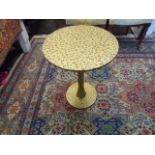 A metal occasional table with Leopard skin print