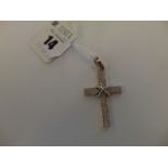 An 18ct White Gold cross pendant with 2.