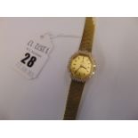 A Universal Geneve 14ct Gold watch with Diamonds, total weight 32 grams,