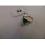 An 18ct Gold Cabochon Emerald set with two Diamonds (.