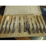 A cased 12 piece fruit set with Silver handles