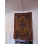 A Persian rug, 143 x 97cm