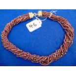 A Ruby rope necklace with a Diamond and