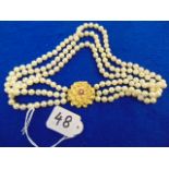 A three row Pearl necklace with 18ct Gol