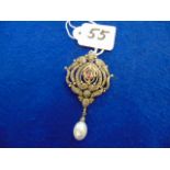 A Diamond and Pearl gem set pendant