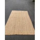 A large sea grass style rug, hand made,