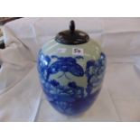 A blue and white oriental lidded vase