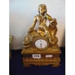 A brass mantle clock