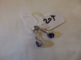 A pair of 18ct Sapphire and Diamond earrings,