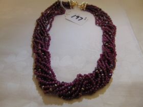 A Ruby rope necklace with a Diamond and Gold clasp