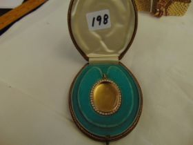 A 15ct Gold and Pearl locket