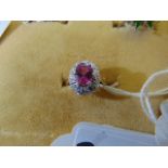 An 18ct Gold, Sapphire, Diamond cluster ring, centre Pink exquisite Sapphire, 1.