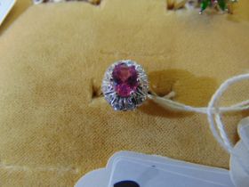 An 18ct Gold, Sapphire, Diamond cluster ring, centre Pink exquisite Sapphire, 1.