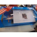 A boxed, model racing car, signed by Nigel Mansell on car,